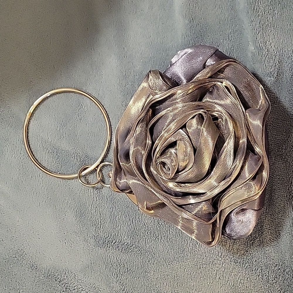 Bought in Paris boutique Unknown designer.. Silver Rose Clutch. Sexy elegant